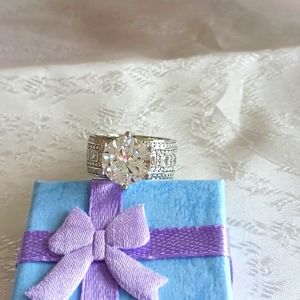 Wide band solitaire ring